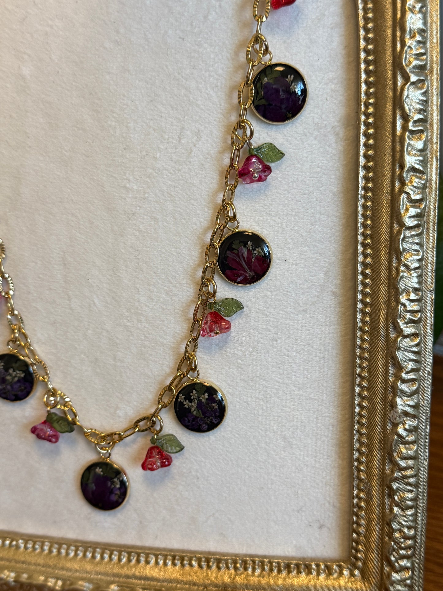 Gold charm necklace (black resin)