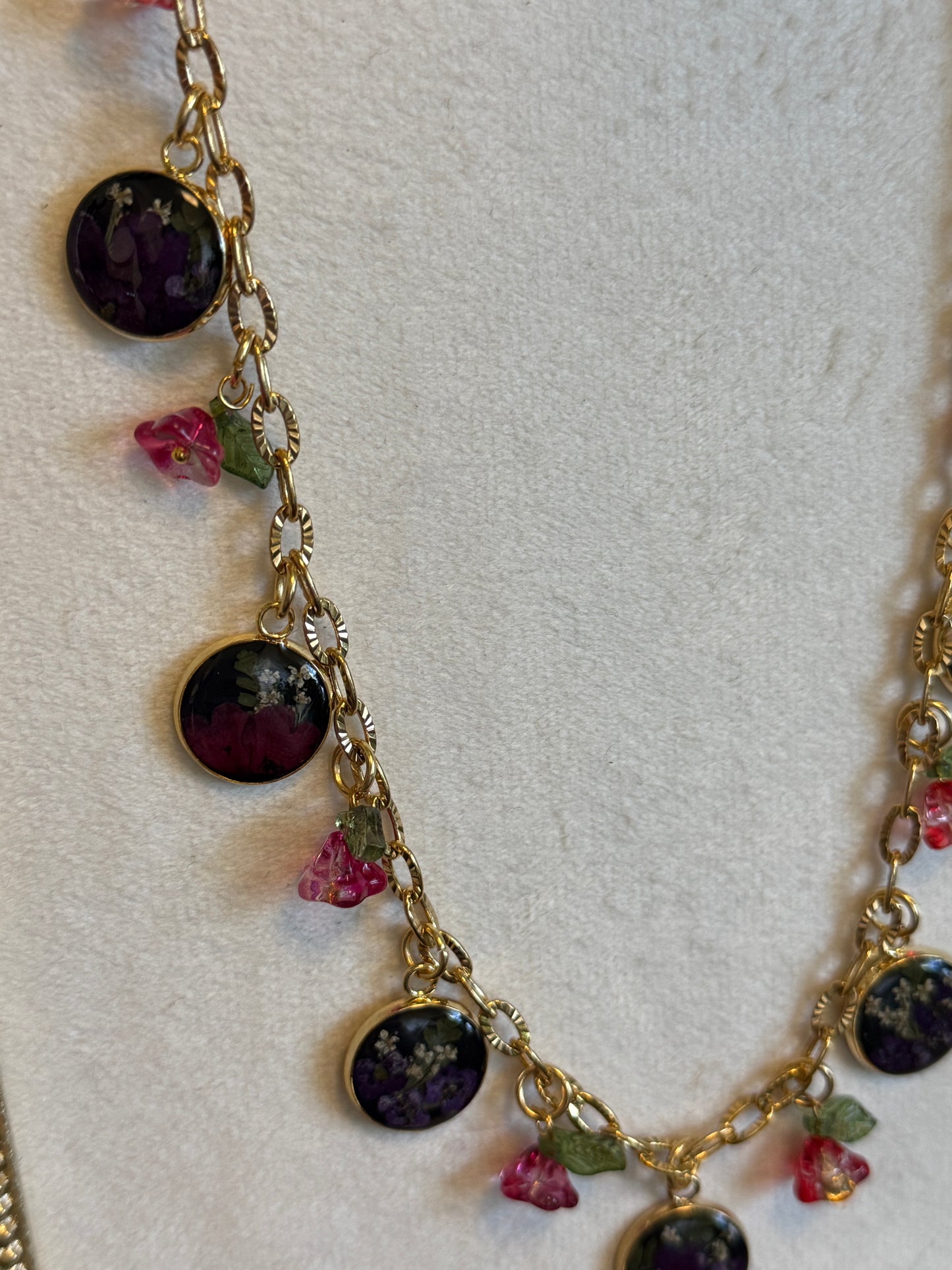 Gold charm necklace (black resin)