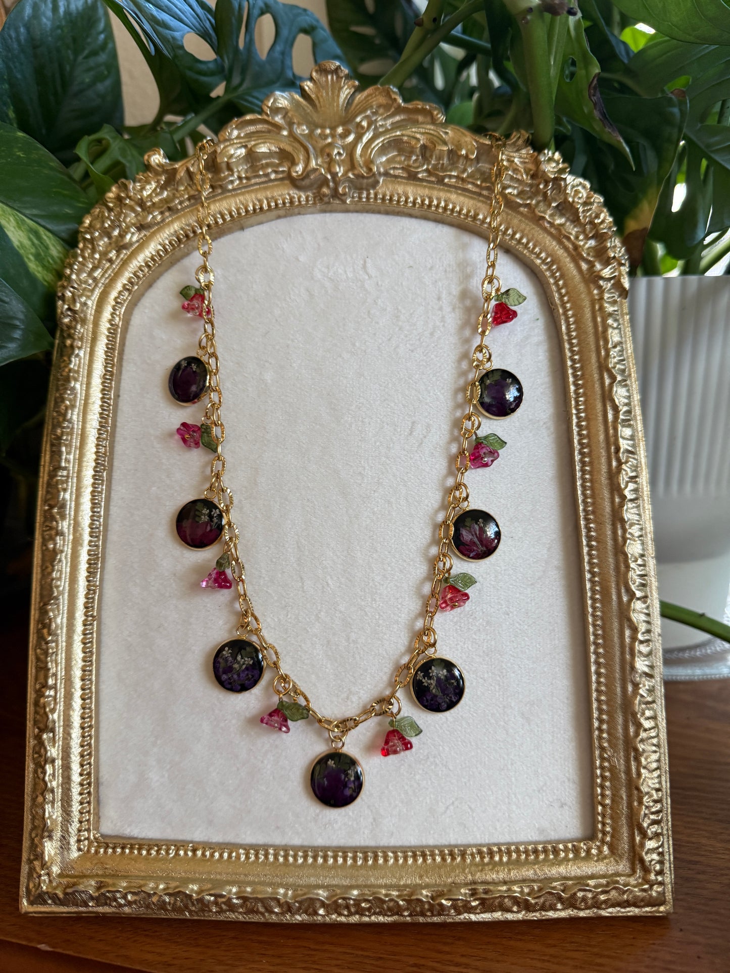 Gold charm necklace (black resin)