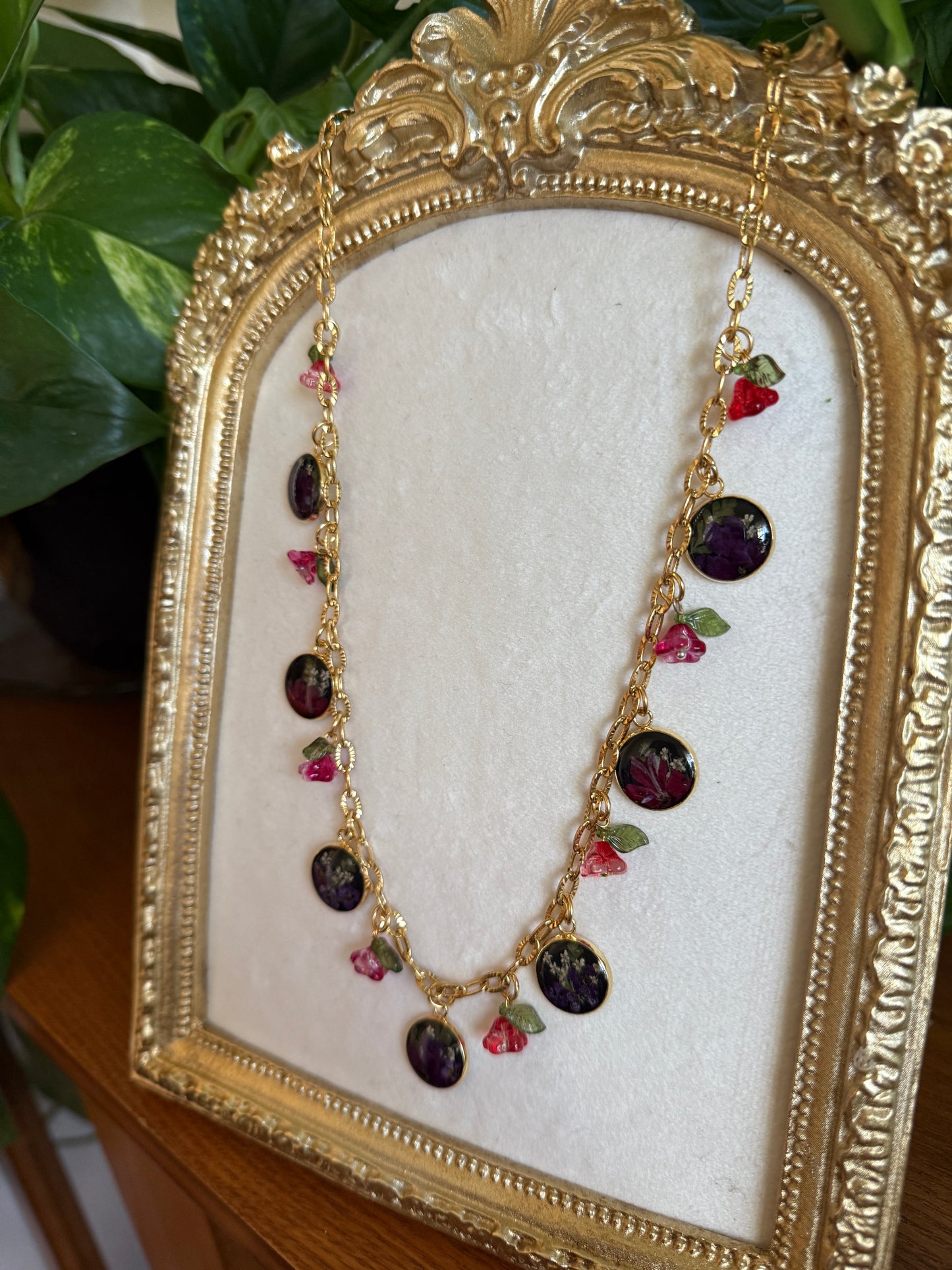 Gold charm necklace (black resin)